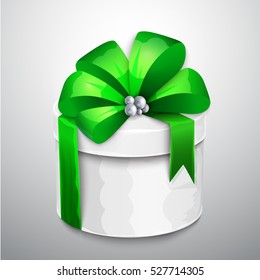 Christmas wrapped gift box with big satin bow and tag.