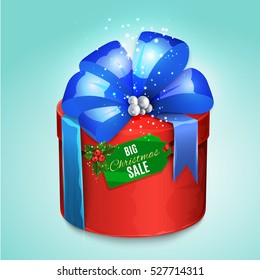 Christmas wrapped gift box with big satin bow and tag.