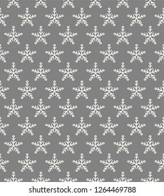 Christmas wrapping paper with hand drawn snowflakes. Vector.