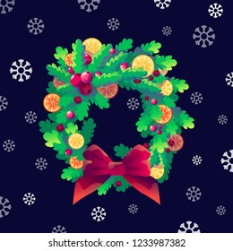 Christmas wreath. Decoration of holly, orange and cinnamon with a bow of snowflakes.