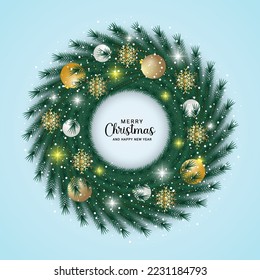 Christmas wreath green leaf with a white ornament with gold ball and snow