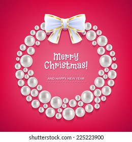 Christmas wreath made of white pearls decorated with bow.