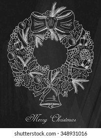 Christmas wreath on chalkboard