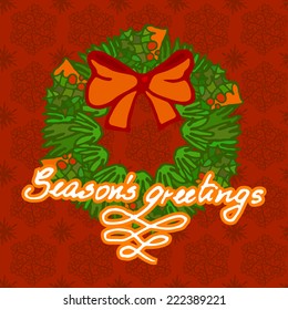 Christmas wreath with red bow on red seamless background with snowflakes and calligraphic writing saying Seasons Greetings.