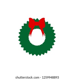 Christmas wreath with red ribbon on white background.