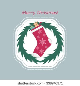 Christmas wreath with red sock. The Christmas greeting card.