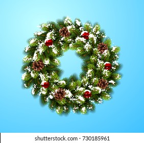 Christmas wreath in snow with balls on blue background. Vector Illustration