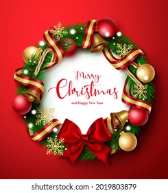 Christmas wreath vector design. Merry christmas and happy new year greeting text in wreath fir branches element with colorful ball, bell and ribbon xmas decoration in red background.