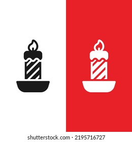 Christmas Xmas Candle Vector icon in Glyph Style. Candles are brightly lit at Christmas when Christians worship. Vector illustration icon that can be used for apps, websites, or part of a logo