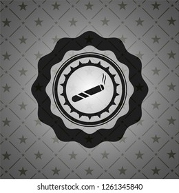 Cigarette icon inside dark emblem. Retro