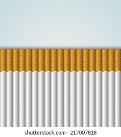 Cigarettes stacked up side by side on pale background