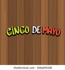 Cinco de Mayo banner with hand drawn calligraphy lettering. Mexican fiests holiday vector background. Cinco de Mayo calligraphic greeting card or poster on wooden background