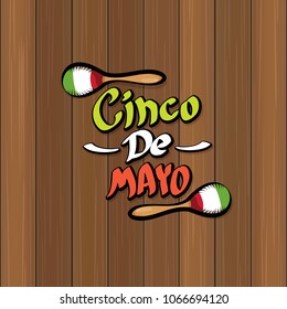 Cinco de Mayo banner with hand drawn calligraphy lettering. Mexican fiests holiday vector background. Cinco de Mayo calligraphic greeting card or poster on wooden background