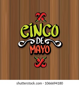 Cinco de Mayo banner with hand drawn calligraphy lettering. Mexican fiests holiday vector background. Cinco de Mayo calligraphic greeting card or poster on wooden background