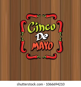 Cinco de Mayo banner with hand drawn calligraphy lettering. Mexican fiests holiday vector background. Cinco de Mayo calligraphic greeting card or poster on wooden background