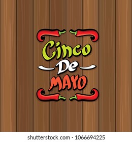 Cinco de Mayo banner with hand drawn calligraphy lettering. Mexican fiests holiday vector background. Cinco de Mayo calligraphic greeting card or poster on wooden background