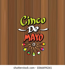 Cinco de Mayo banner with hand drawn calligraphy lettering. Mexican fiests holiday vector background. Cinco de Mayo calligraphic greeting card or poster on wooden background