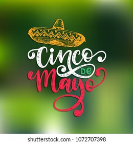 Cinco De Mayo, hand lettering. Translation from Spanish 5 May. Vector calligraphy with illustration of sombrero. Used for greeting card, poster design. 