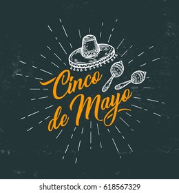 Cinco de Mayo hand sketched logotype, badge typography icon. Lettering Mexican holiday with hat, maracas for greeting card, invitation. Retro lettering banner poster template black board background