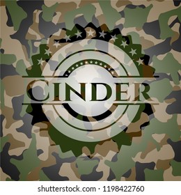 Cinder written on a camouflage texture