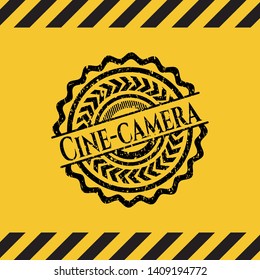 Cine-camera black grunge emblem, yellow warning sign. Vector Illustration. Detailed.