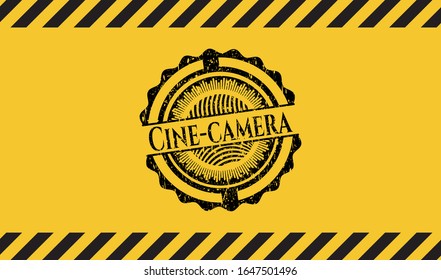 Cine-camera grunge black emblem with yellow background, warning sign. Vector Illustration. Detailed.