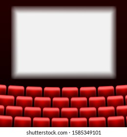 Cinema auditorium with screen and red seats.
