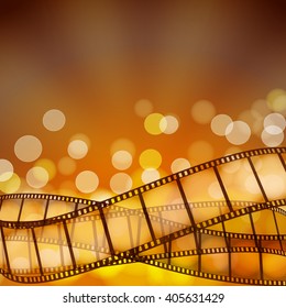 cinema background with film strips and light rays. vector illustration