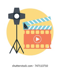 
Cinema concept with spotlight and clapperboard. Flat vector icons 
