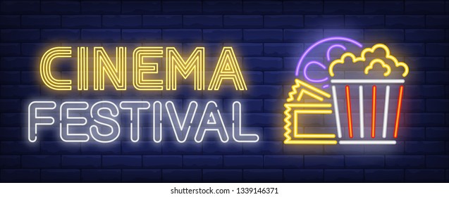 Cinema festival neon text with popcorn, tickets and film reel. Entertainment concept, advertisement design. Night bright neon sign, colorful billboard, light banner. Vector illustration in neon style.