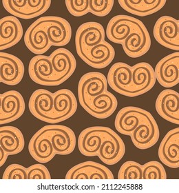 Cinnamon bun seamless pattern. Sweet roll with chocolate in the shape of a heart on brawn background. Vector illustration 