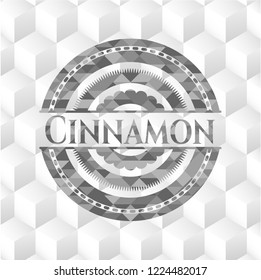 Cinnamon grey badge with geometric cube white background