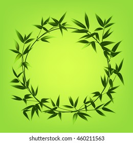Circle frame of bamboo over green background.