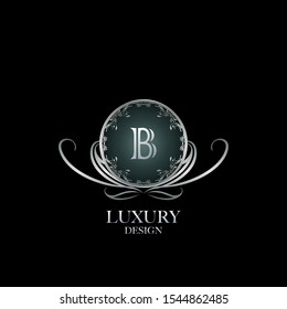 Circle Luxury Logo Letter B. Elegant logo design concept letter  B on silver circle  frame with floral element for boutique, hotel, fashion and more brands.