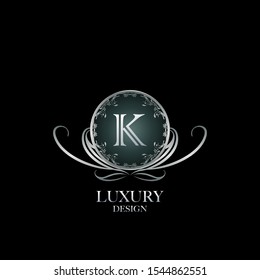 Circle Luxury Logo Letter K. Elegant logo design concept letter K on silver circle  frame with floral element for boutique, hotel, fashion and more brands.