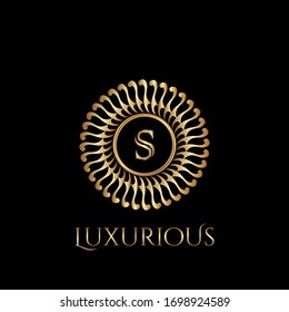 Circle luxury logo with letter S and symmetric swirl shape vector design logo gold color.