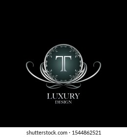 Circle Luxury Logo Letter T. Elegant logo design concept letter T on silver circle  frame with floral element for boutique, hotel, fashion and more brands.