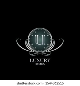 Circle Luxury Logo Letter U. Elegant logo design concept letter U on silver circle  frame with floral element for boutique, hotel, fashion and more brands.
