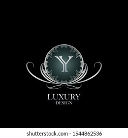 Circle Luxury Logo Letter Y. Elegant logo design concept letter Y on silver circle  frame with floral element for boutique, hotel, fashion and more brands.