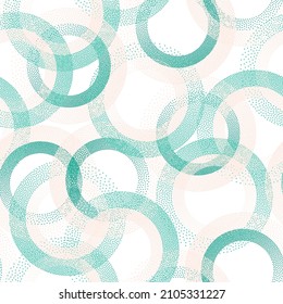Circle ring shapes of dots contemporary vector seamless pattern. Circular shapes of halftone point endless wallpaper ornament. Tileable background with circles of dots.