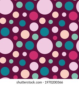 Circles of different colors and sizes on a dark background. Seamless polka dot background.
