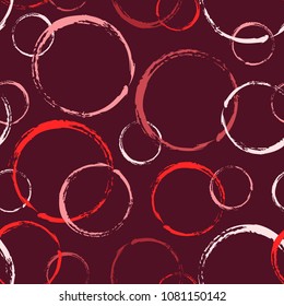 Circles with a fuzzy outline. Seamless pattern in red tones.
