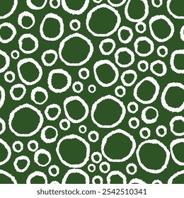 Circles seamless patten. Hand drawn white rings on green background. Abstract circle background. 