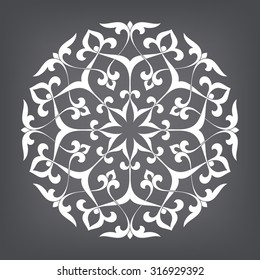 Circular abstract floral pattern. Mandala. Round vector ornament with intertwined branches, flowers  and curls. Arabesque.