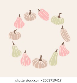 A circular arrangement of gently colored pumpkins in various shapes against a soft background