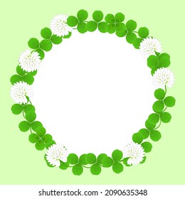 Circular frame of wreath made of white clover flowers and leaves