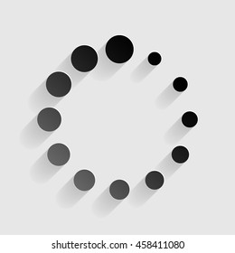 Circular loading sign. Black paper with shadow on gray background.