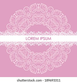 circular ornament for decor in bright colors on a light lilac background with white lace ribbon