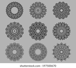 Circular ornate and intricate Celtic ornaments in black and white isolated over grey background