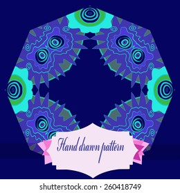 Circular pattern of colored floral motif, label. Hand drawn.